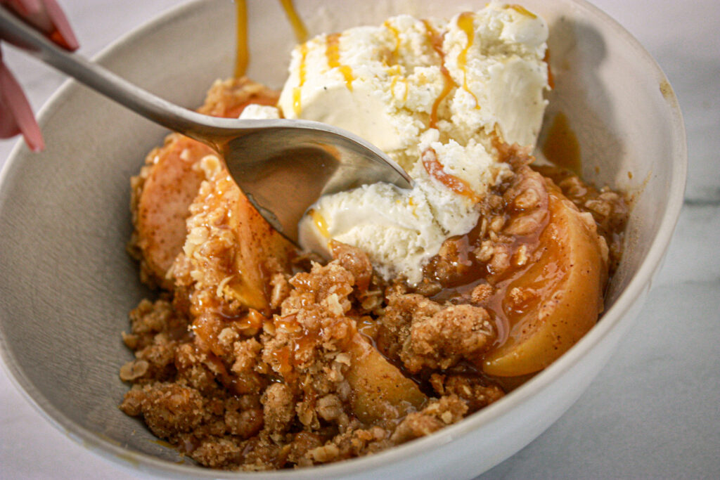 spoon of vegan apple crisp