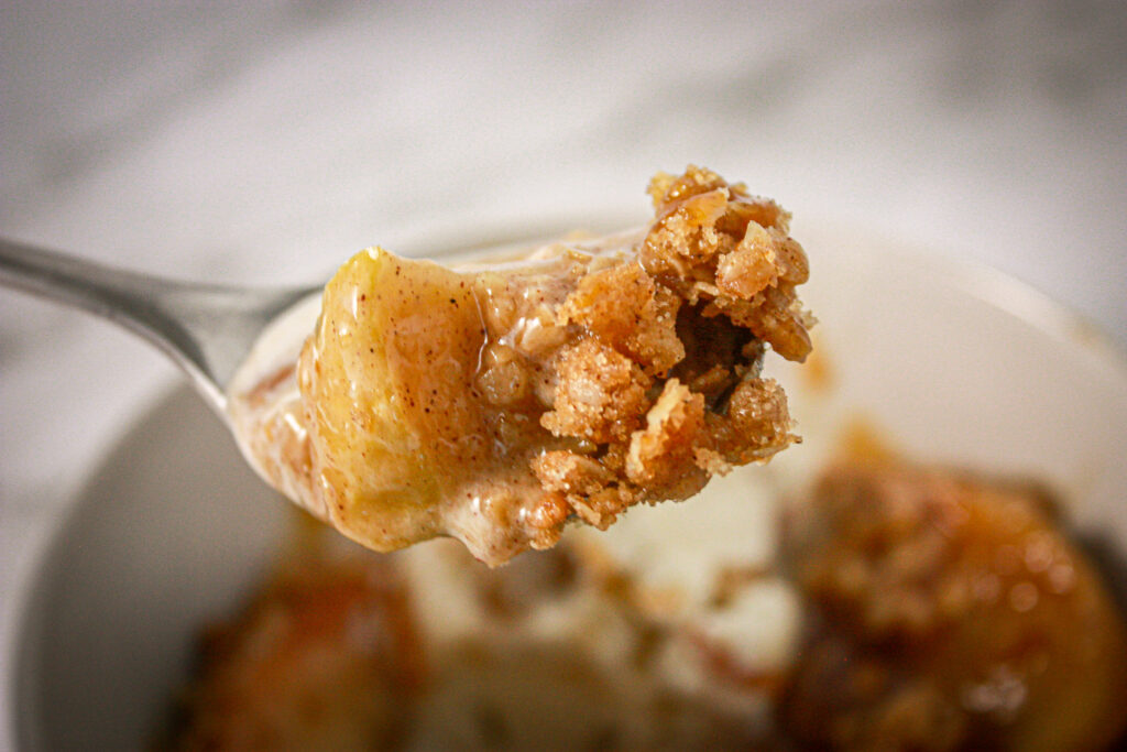 bite of baked apple crisp