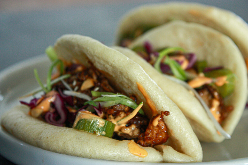 duck bao buns with pickled cucumbers