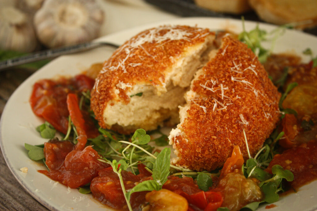 fried vegan burrata cheese with blistered tomatoes