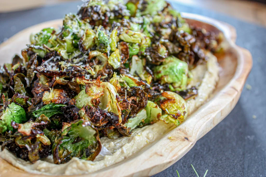 hummus with brussel sprouts and parmesan